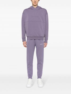 Spodnie sportowe bawełniane z nadrukiem Calvin Klein fioletowe