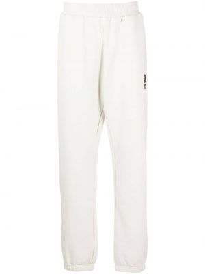 Sportovní kalhoty s výšivkou jersey Izzue bílé