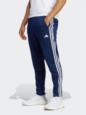Spodnie sportowe w paski Adidas niebieskie