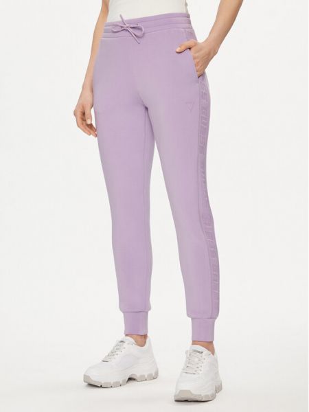 Priliehavé teplákové nohavice Guess fialová