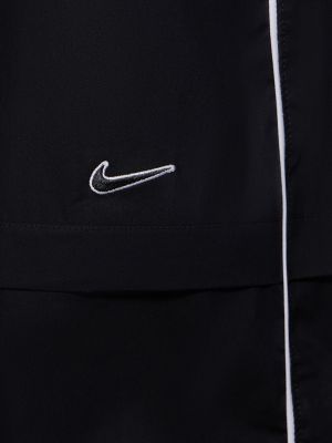 Pletená bavlnená sukňa Nike čierna