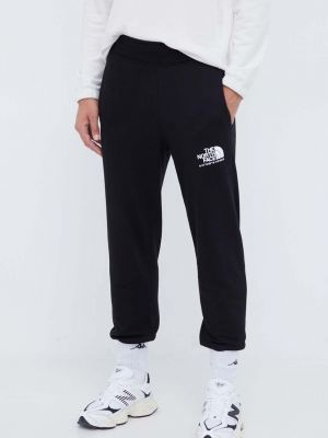 Bavlněné sportovní kalhoty s potiskem The North Face černé