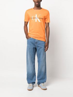 Bavlněné tričko s potiskem Calvin Klein Jeans oranžové