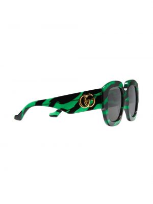 Pruhované sluneční brýle s potiskem Gucci Eyewear