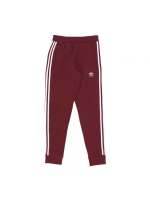 Spodnie sportowe w paski Adidas czerwone