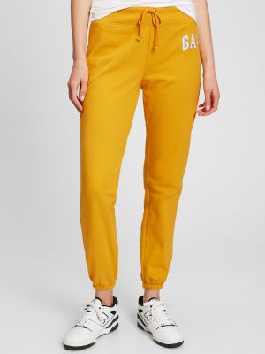 Teplákové nohavice Gap oranžová