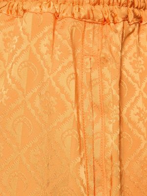 Žakárové voľné saténové nohavice Marine Serre oranžová