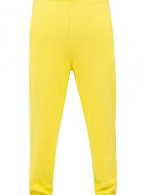 Teplákové nohavice Urban Classics žltá