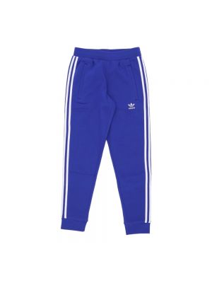 Spodnie sportowe w paski Adidas niebieskie