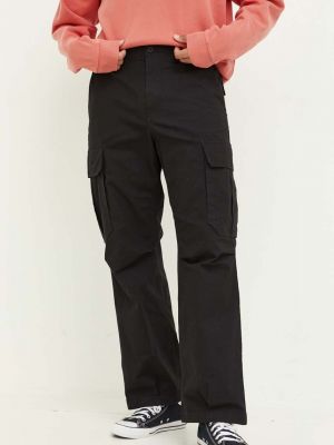 Jednobarevné kalhoty Tommy Jeans černé