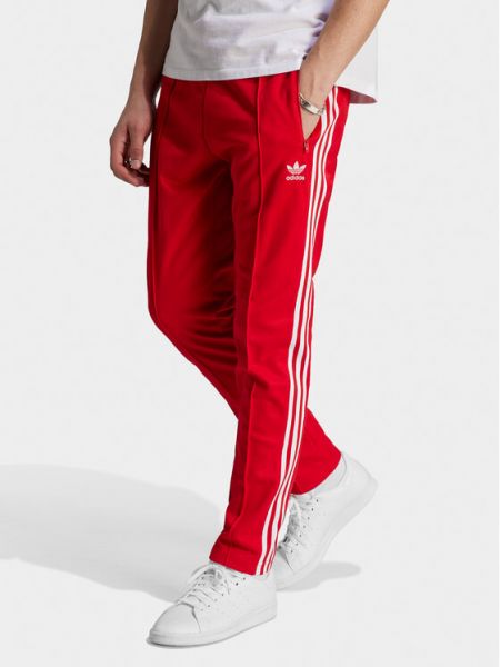 Slim fit priliehavé teplákové nohavice Adidas červená