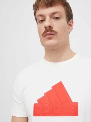 Bavlněné tričko s aplikacemi Adidas béžové