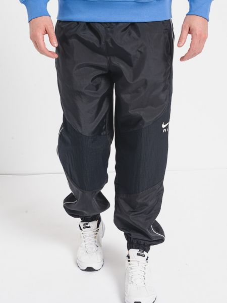 Спортивные штаны свободного кроя с карманами Nike черные