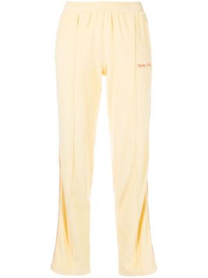 Bavlněné sportovní kalhoty s výšivkou Sporty & Rich žluté