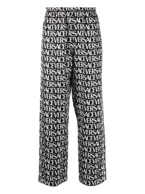 Pantaloni con stampa Versace