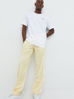 Sportovní kalhoty Adidas Originals žluté