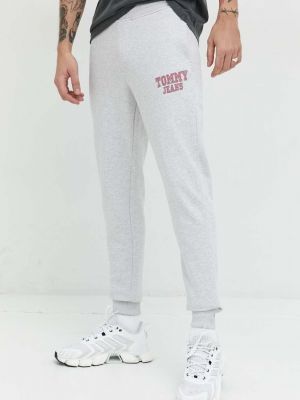 Spodnie sportowe bawełniane z nadrukiem Tommy Jeans szare