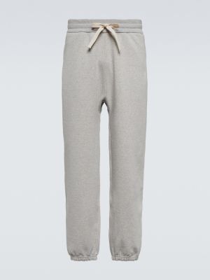 Bavlnené teplákové nohavice Jil Sander sivá