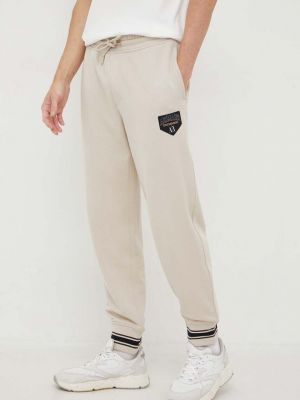 Sportovní kalhoty s aplikacemi Armani Exchange hnědé