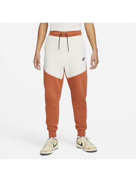 Joggery męskie Nike Sportswear Tech Fleece - Pomarańczowy