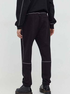 Bavlněné sportovní kalhoty s aplikacemi Hugo černé