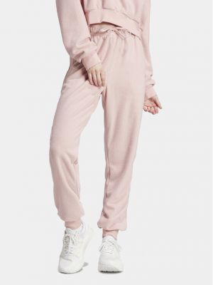 Priliehavé teplákové nohavice Adidas ružová