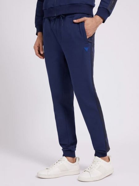 Spodnie sportowe z nadrukiem bawełniane Guess niebieskie