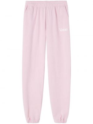 Bavlněné sportovní kalhoty s výšivkou Versace růžové