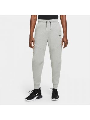 Fleecové teplákové nohavice Nike sivá