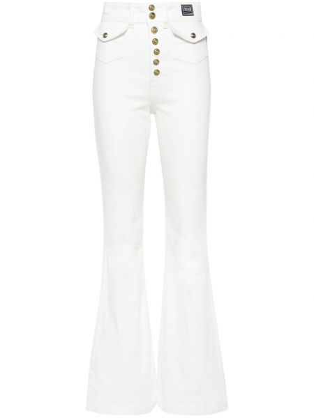 Medvilninės platėjantys džinsai aukštu liemeniu Versace Jeans Couture balta
