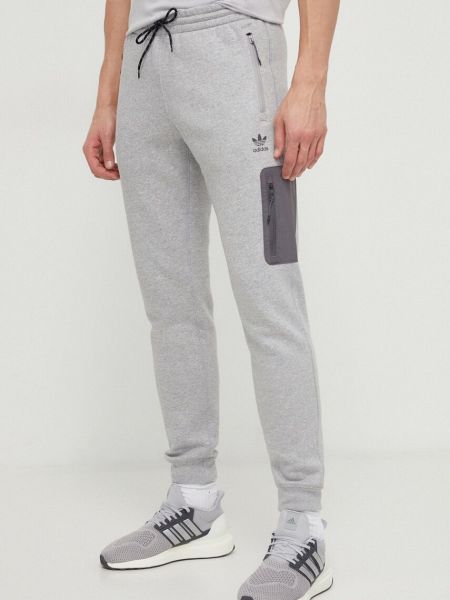 Melanžové sportovní kalhoty Adidas Originals šedé