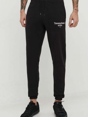 Bavlněné sportovní kalhoty s potiskem Tommy Jeans černé