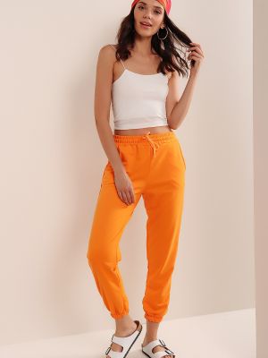 Teplákové nohavice Hakke oranžová