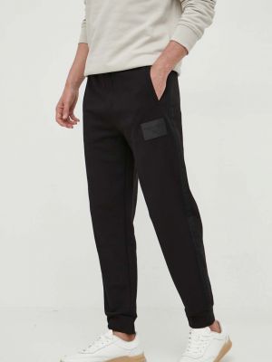 Bavlněné sportovní kalhoty Armani Exchange černé