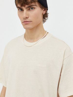 Koszulka bawełniana w jednolitym kolorze Levi's beżowa