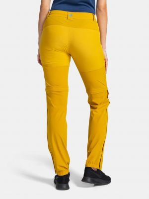 Teplákové nohavice Kilpi žltá