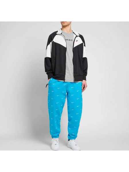 Спортивные штаны с принтом Nike синие