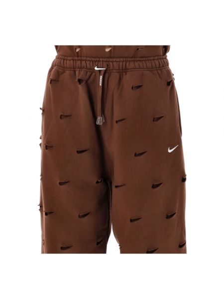 Spodnie sportowe Nike brązowe