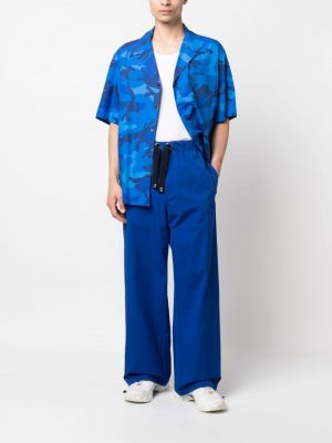 Spodnie sportowe bawełniane relaxed fit Versace niebieskie