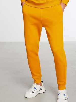 Voľné teplákové nohavice Grimelange žltá