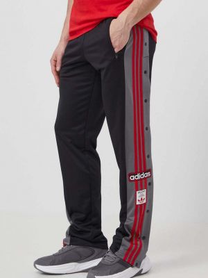 Spodnie sportowe na zamek z kieszeniami na guziki Adidas Originals czarne
