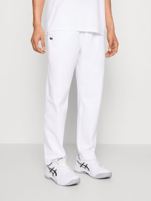 Белые спортивные штаны Lacoste