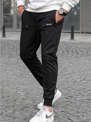 Běžecké kalhoty Madmext černé