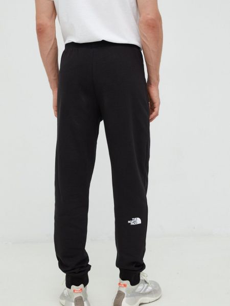 Bavlněné sportovní kalhoty The North Face černé
