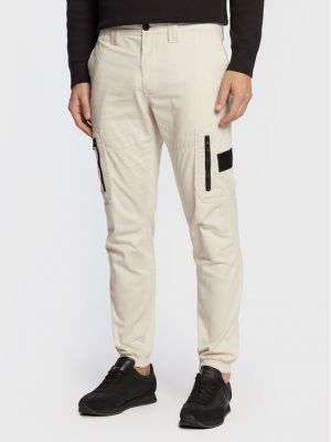 Běžecké kalhoty skinny fit Calvin Klein Jeans béžové