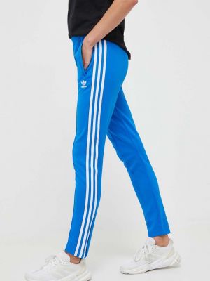 Sportovní kalhoty s aplikacemi Adidas Originals modré