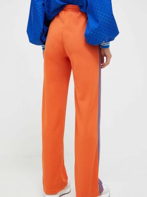 Sportovní kalhoty Adidas Originals oranžové