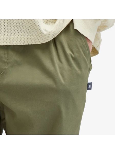 Спортивные штаны слим New Balance зеленые