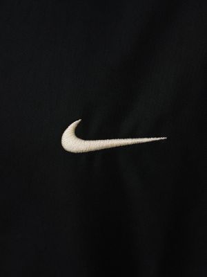 Pletena parka iz najlona Nike črna