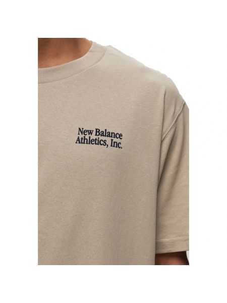 Koszulka bawełniana New Balance beżowa